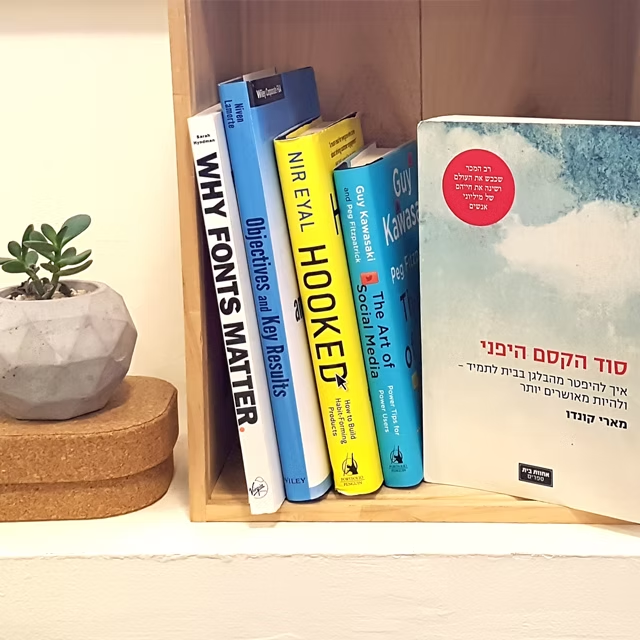 Bookshelf featuring Marie Kondo's 'The Life-Changing Magic of Tidying Up' alongside design and product books